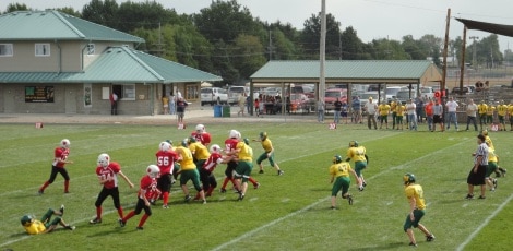 Junior Football League players during game on a football field in Mattoon IL
